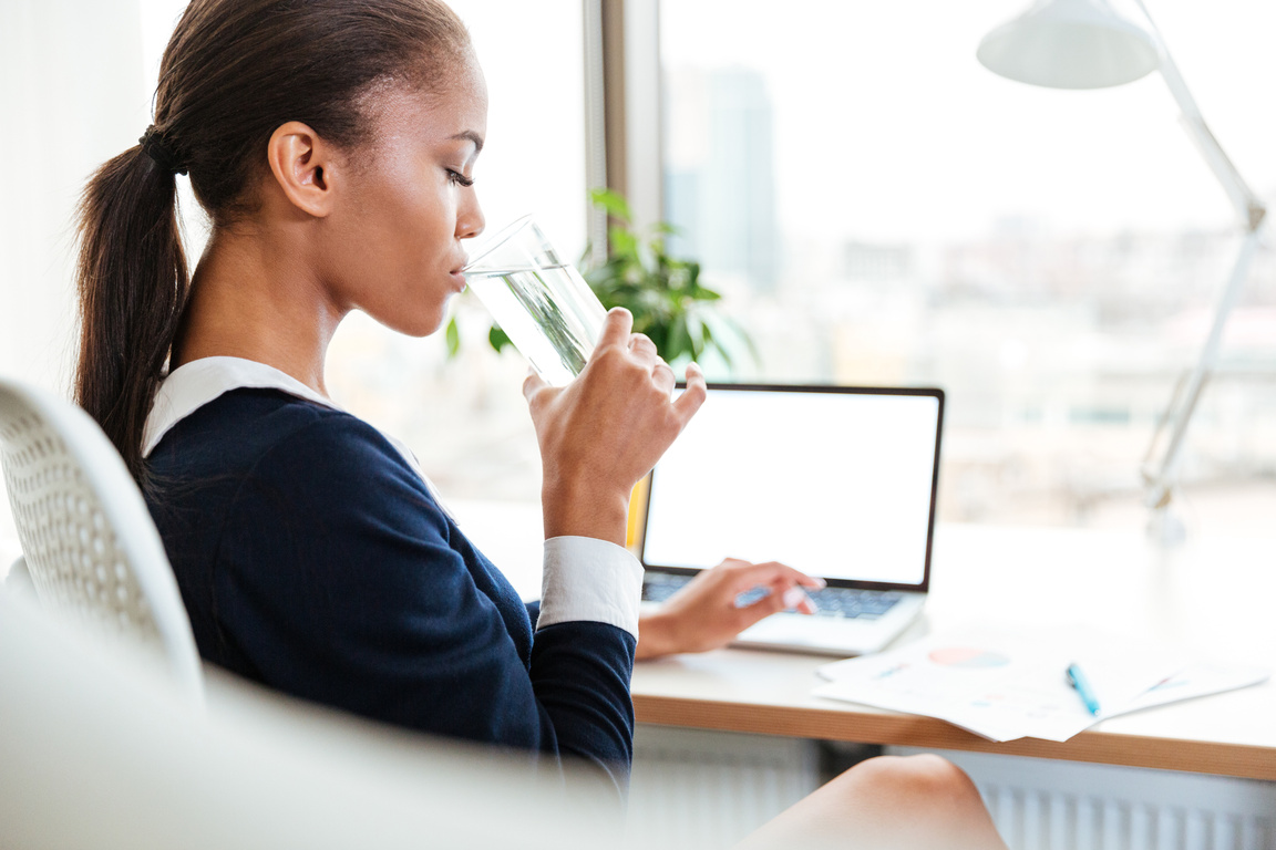 African Business Woman Drinking Water